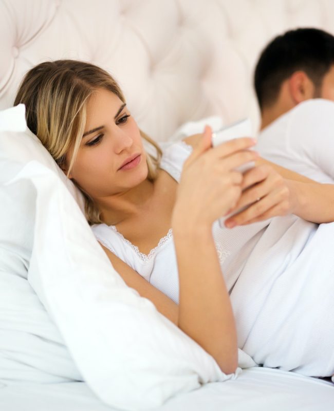 Young unhappy couple having problems in relationship